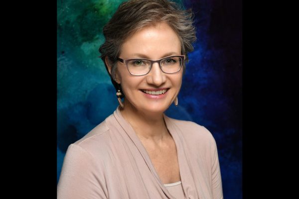 Studio photo of AnnMarie Maurer, owner of Footloose Massage Center, c.2016